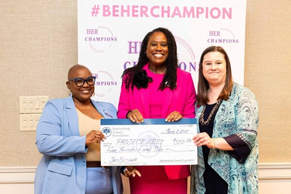 Project R.E.S.T's Krystal Watson Receiving the "Just Because" award at the Be HER Champion Women's Day Celebration